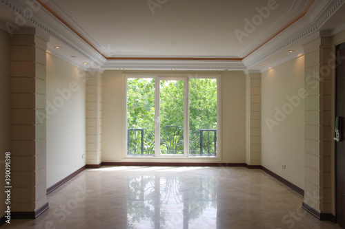 Empty hall of the house with windows
