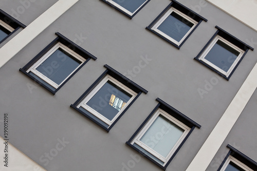 Building facade with square windows and sky