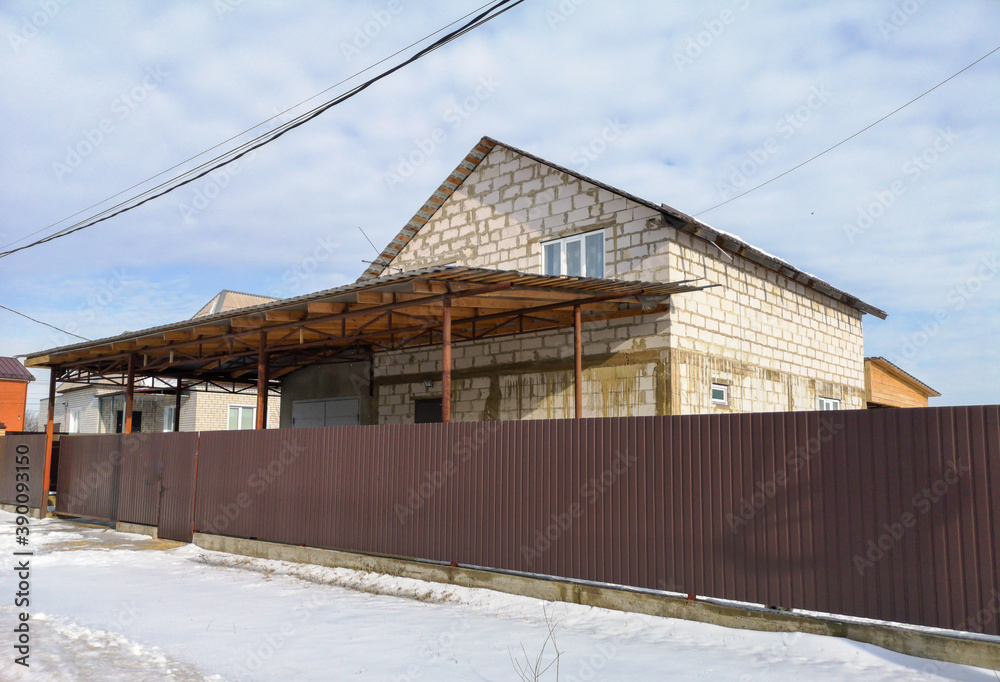 Foam block house under construction in winter. Foam block house under construction in winter.