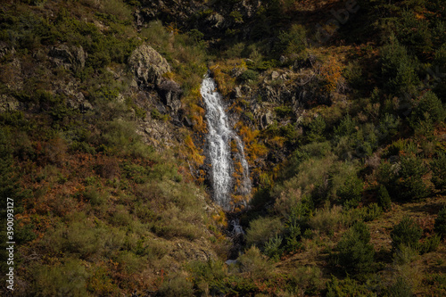 Cascade of cold and icy water. Aragonese Pyrenees, near of Aguas Tuertas valley, Hecho and Anso, Huesca, Spain. photo