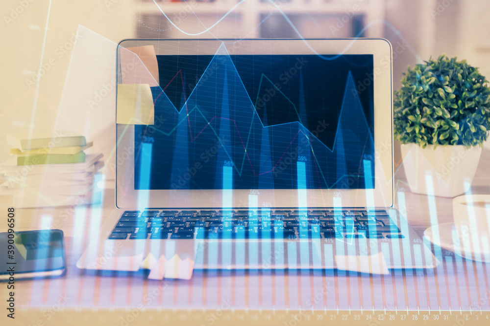 Financial graph colorful drawing and table with computer on background. Multi exposure. Concept of international markets. Financial graph colorful drawing and table with computer on background. Multi exposure. Concept of international markets.