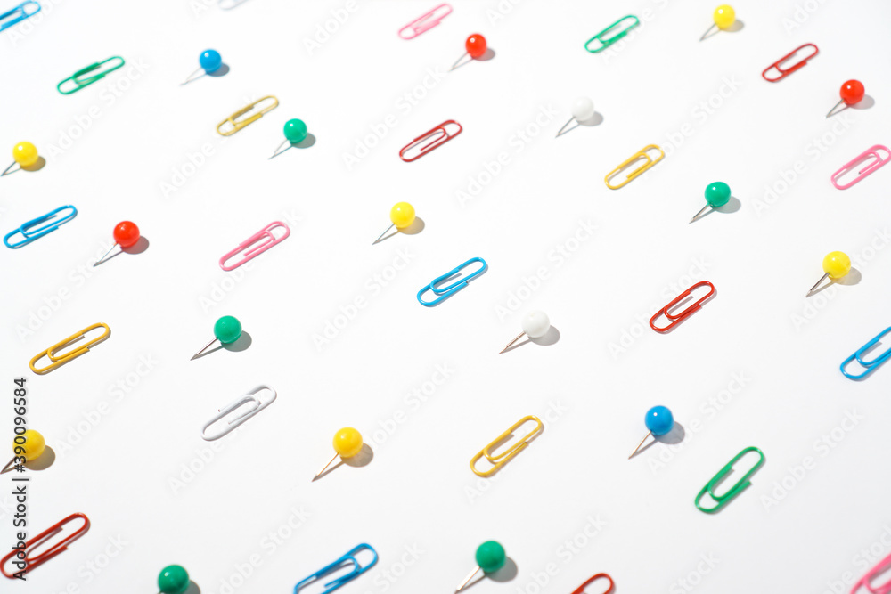 Creative pattern colorful paper clips and pin board. Creative pattern colorful paper clips and pin board.