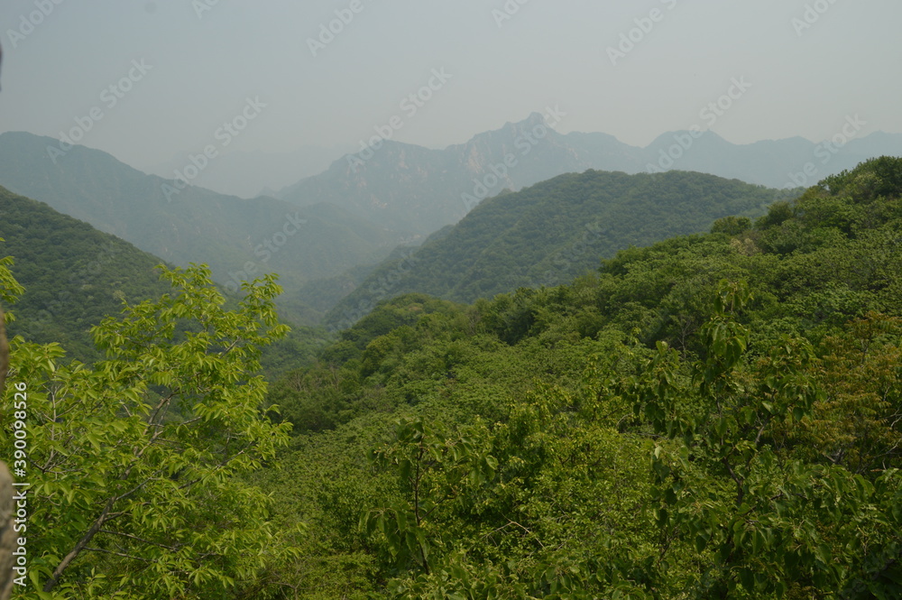 Hiking in the beautiful Chinese mountain landscapes and on the ancient historical Great Wall of China Hiking in the beautiful Chinese mountain landscapes and on the ancient historical Great Wall of China