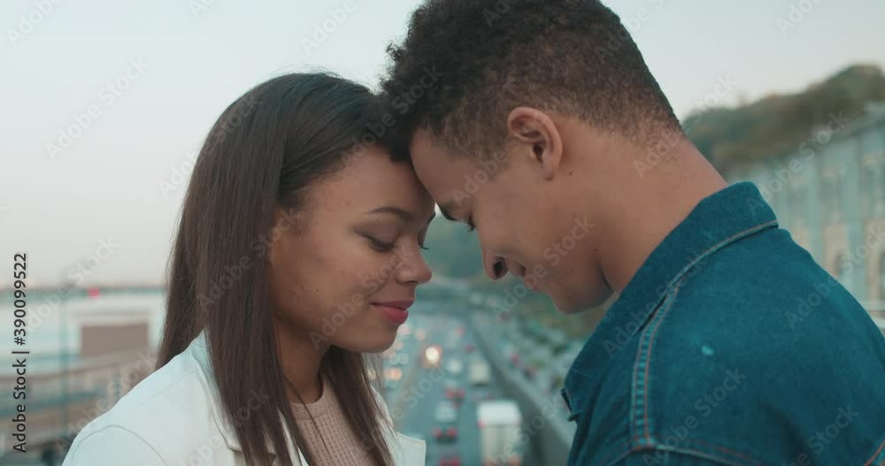 Young black man and woman touching foreheads, tender feelings, romantic date Young black man and woman touching foreheads, tender feelings, romantic date