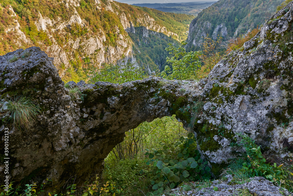 Natural stone arch in the mountains