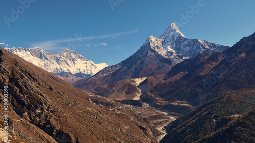 Spectacular panorama view of Sherpa village Pangboche (Panboche) in valley below majestic snow-capped mountain Ama Dablam and Mount Everest massif including Nuptse and Lhotse) in the Himalayas, Nepal.