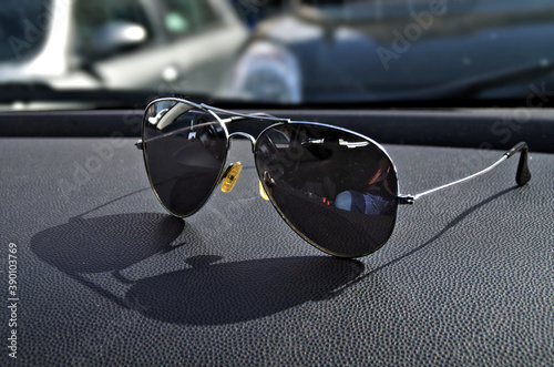 sunglasses on can dashboar photo