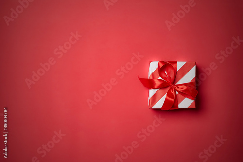 Christmas gift box, Christmas ball Ornaments on red background top flat layout blank copy space for text.