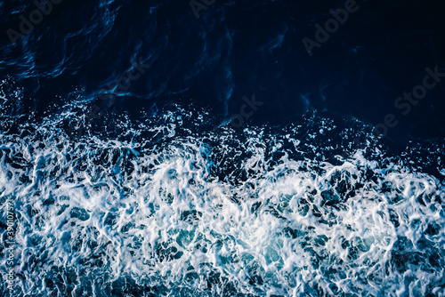 Bright color of sea water. The texture of the water. Natural background.