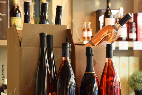 Wine bottles in wine store and ready for home delivery