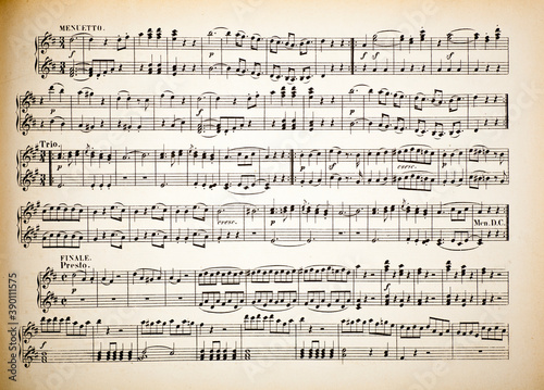 Vintage yellow paper sheet with musical notes.