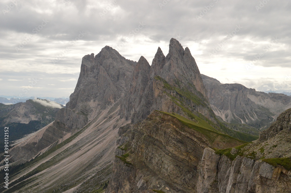Hiking on the dramatic mountain ridge of Seceda in South Tyrol's Dolomites, Northern Italy