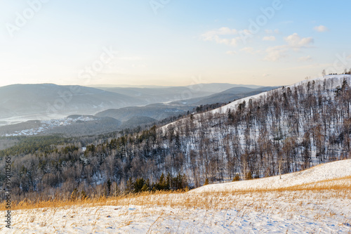 Amazing view of scenic wooded mountains covered with snow