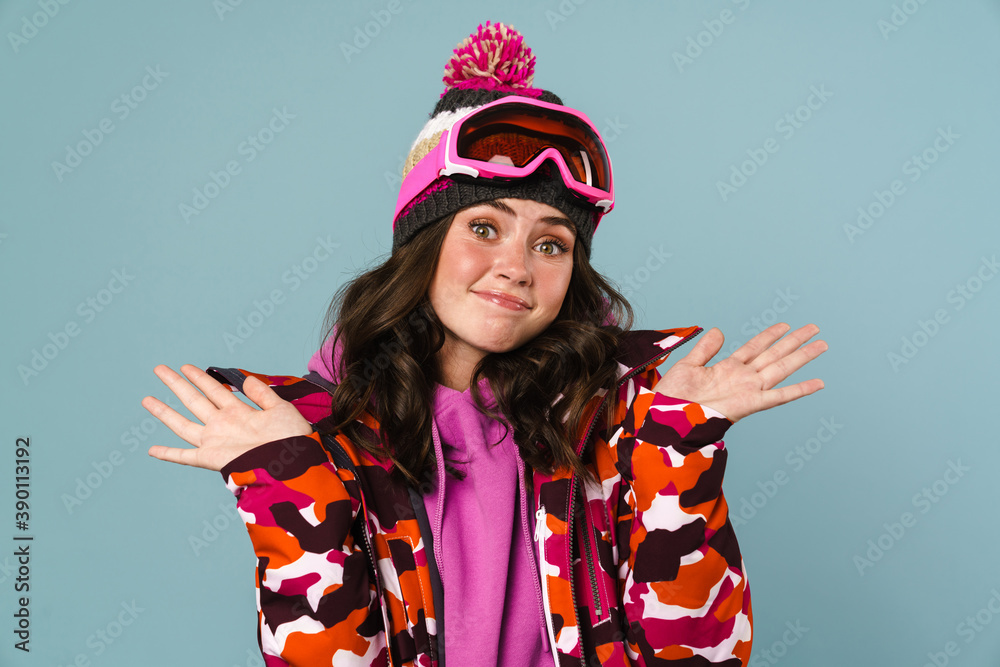 Frustrated young woman wearing snowboard jacket