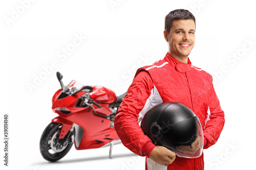 Motorbike racer with a helmet smiling at the camera