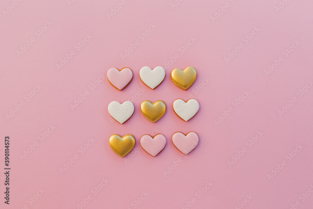 Heart shaped cookies on pink background