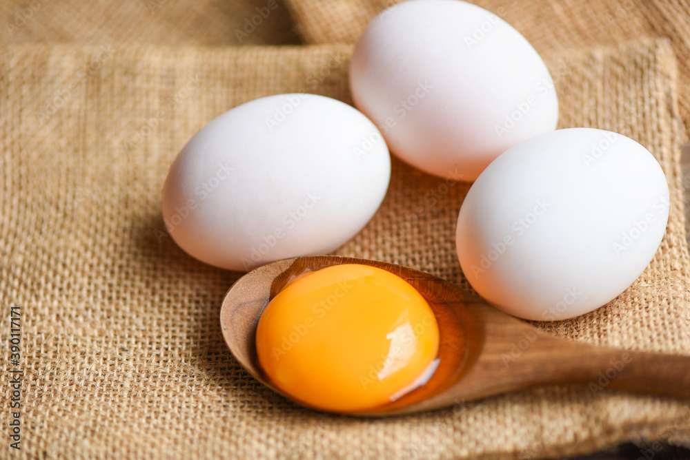 Fresh broken egg yolk, duck eggs white collect from farm products natural in a sack healthy eating Fresh broken egg yolk, duck eggs white collect from farm products natural in a sack healthy eating