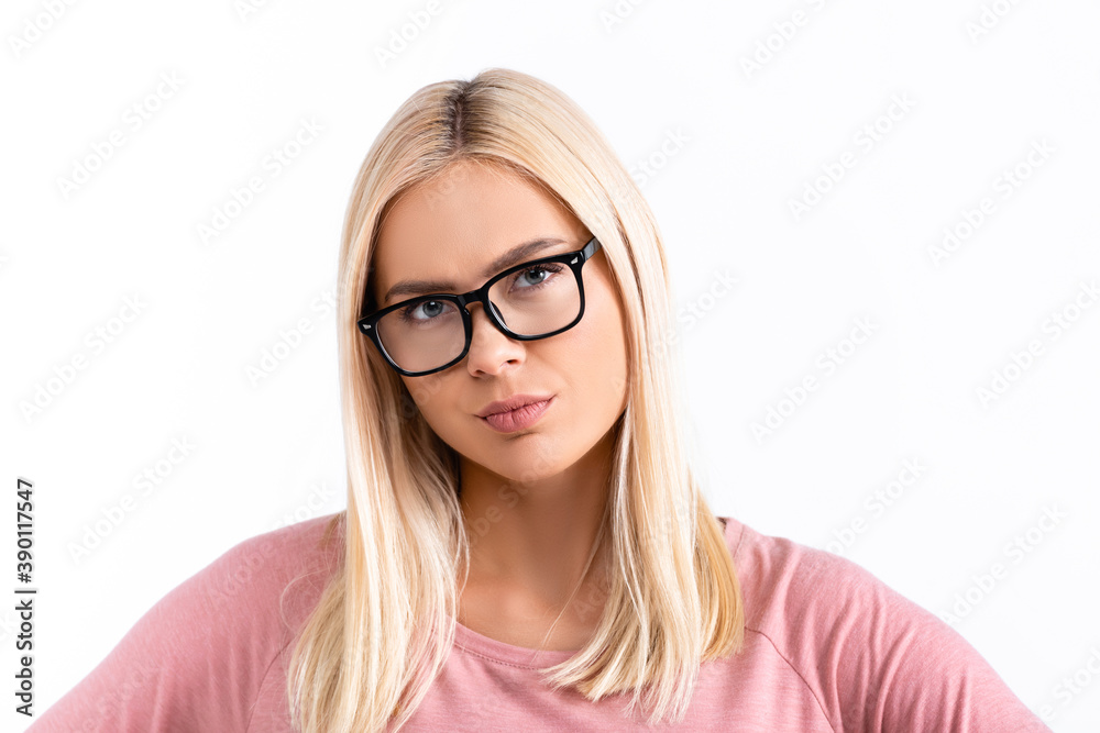 Serious blonde woman in eyeglasses looking at camera isolated on white Serious blonde woman in eyeglasses looking at camera isolated on white