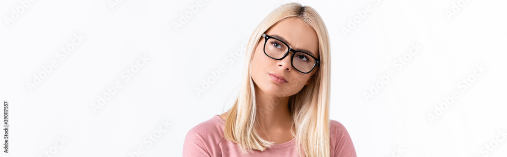 Thoughtful woman in eyeglasses looking away isolated on white, banner