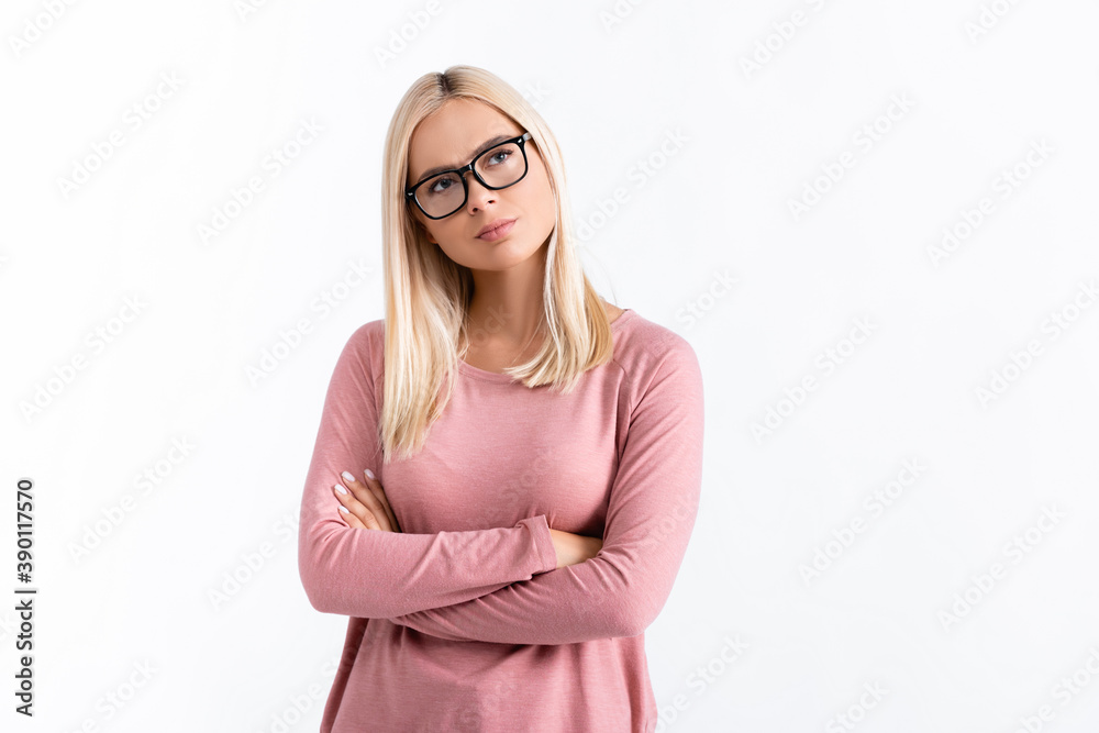 Pensive woman in eyeglasses standing with crossed arms isolated on white Pensive woman in eyeglasses standing with crossed arms isolated on white