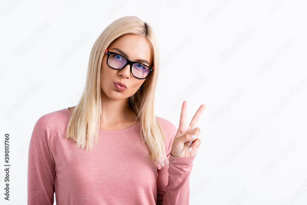 Blonde woman in eyeglasses showing peace sign isolated on white