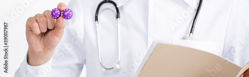 Cropped view of doctor holding folder and lenses container isolated on white , banner
