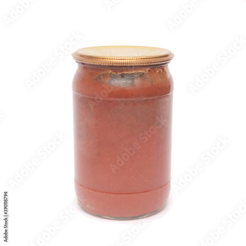 Homemade glass tomato sauce canned food isolated on white background