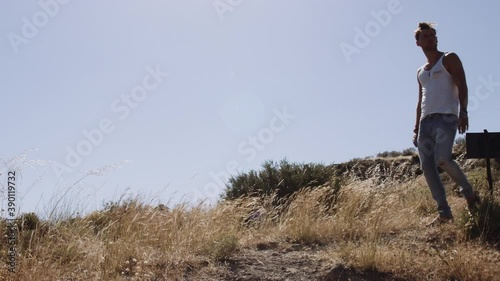 Man Exploring Landscape With Smartphone