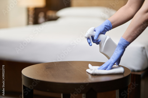 Εκτύπωση καμβά Housemaid wiping bedside table in the bedroom