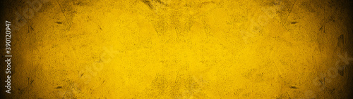 Dark black yellow golden stone concrete paper texture background panorama banner long, with space for text