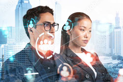 Photography Businessman and businesswoman as a SMM specialists thinking about development of social media marketing strategy to achieve business goals