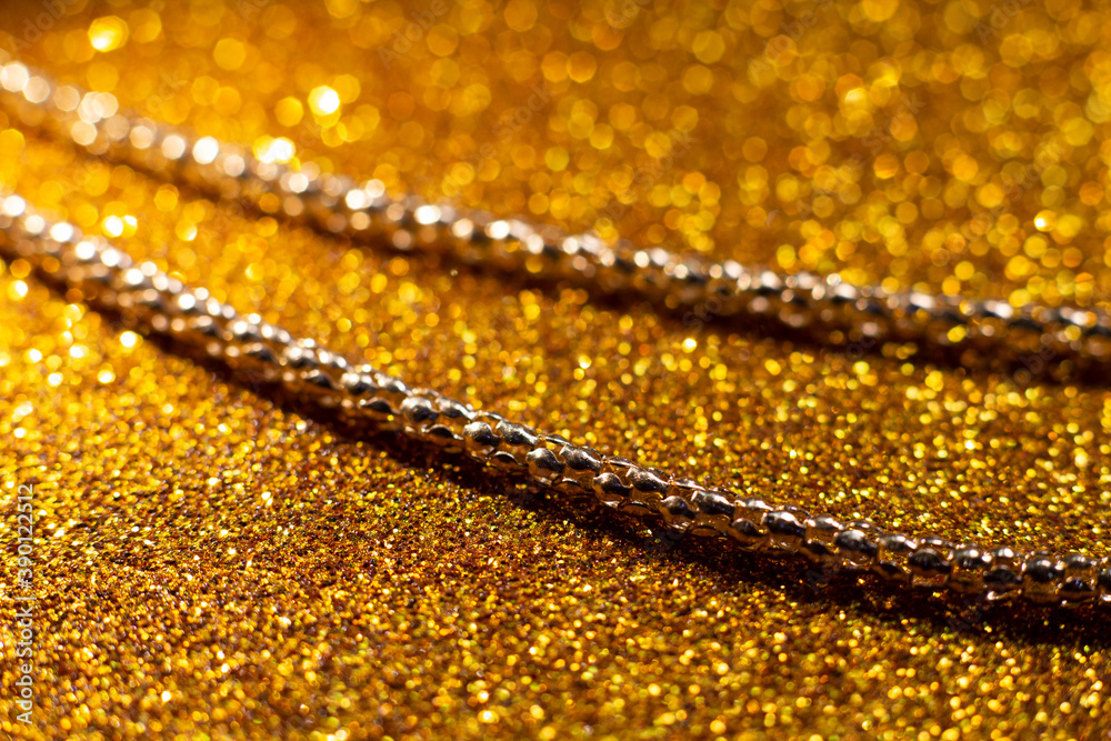 Chain on christmas gold glittering background 