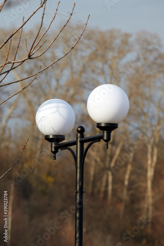 The light on the street. Lamppost. Round lantern.