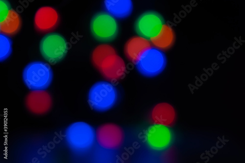 Christmas Abstract blurred pattern of light strands in purple tones as background.