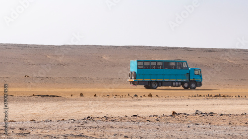 blue truck in the desert
