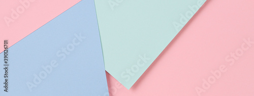 Abstract colored paper banner background. Minimal geometric shapes and lines in pastel pink, light blue and green colours