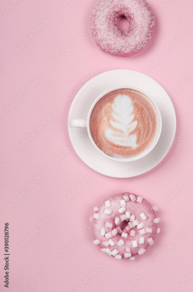 Flat lay composition with two donuts and cup of coffee on pink background Flat lay composition with two donuts and cup of coffee on pink background