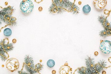 Christmas frame on white holiday background. Gold and blue christmas decorations, Copy space. New Year border.