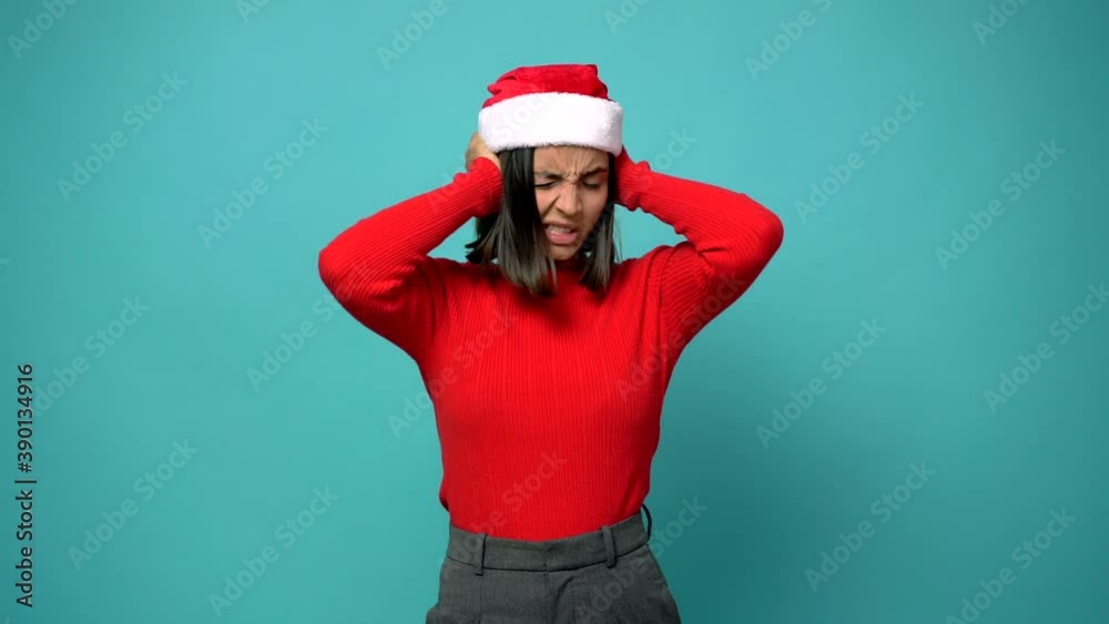 woman covering both ears with hands. Frustrated expression in christmas holidays woman covering both ears with hands. Frustrated expression in christmas holidays