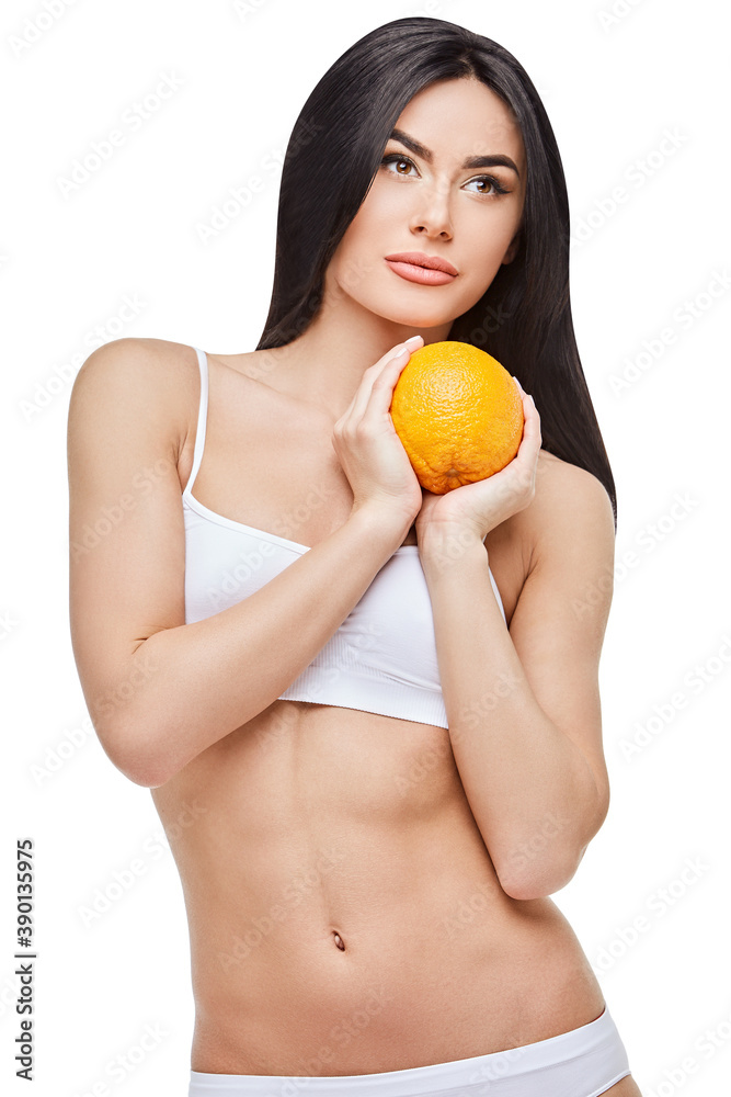 studio shot of attractive young woman with beautiful body holding orange isolated on white studio shot of attractive young woman with beautiful body holding orange isolated on white