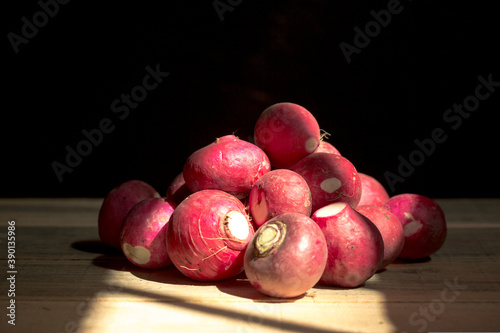 bunch of fresh radish on a wooden background