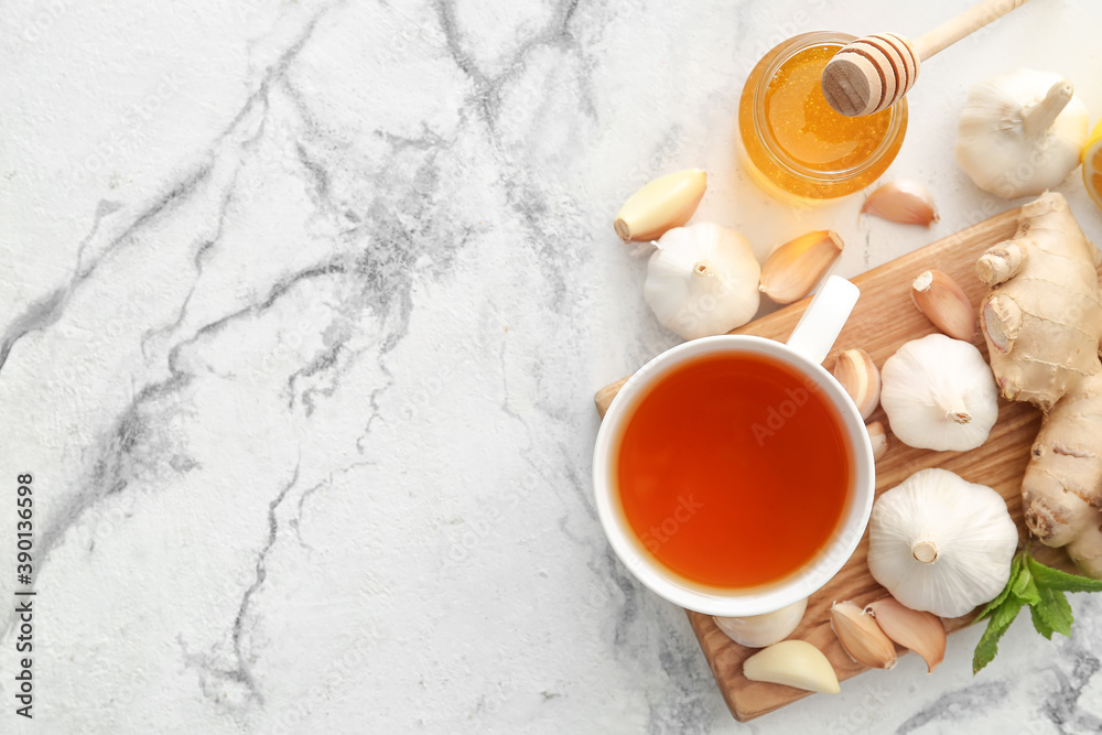 Cup of healthy garlic tea on white background Cup of healthy garlic tea on white background