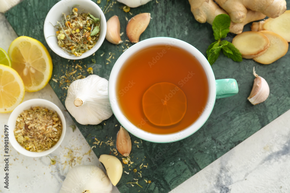 Cup of healthy garlic tea on table Cup of healthy garlic tea on table