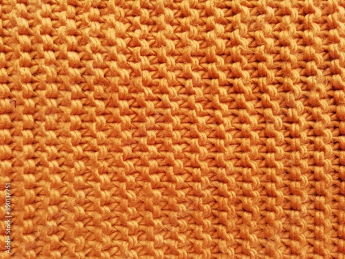  knitted orange background from sweater fabric