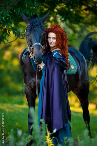 cosplay Braveheart red curly girl with a horse in the woods