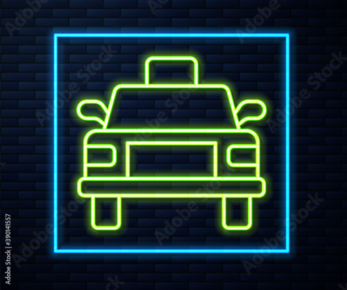 Glowing neon line Taxi car icon isolated on brick wall background. Vector.