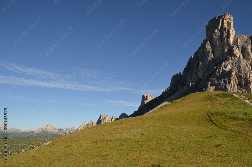 Obraz premium Hiking and climbing at the stunning Passo Giau in the Dolomite mountains of Northern Italy