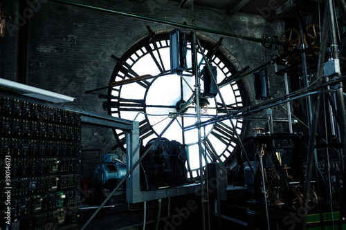 Interior of old big tower clock face mechanism inside brick space