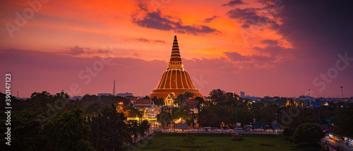 Large golden pagoda Located in the community at sunset , Phra Pathom Chedi , Nakhon Pathom province, Thailand. This is public property, no restrict in copy or use.