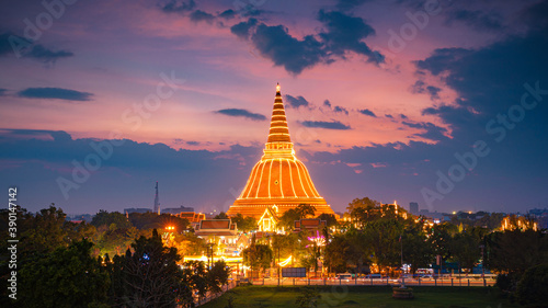 Large golden pagoda Located in the community at sunset , Phra Pathom Chedi , Nakhon Pathom province, Thailand. This is  public property, no restrict in copy or use.